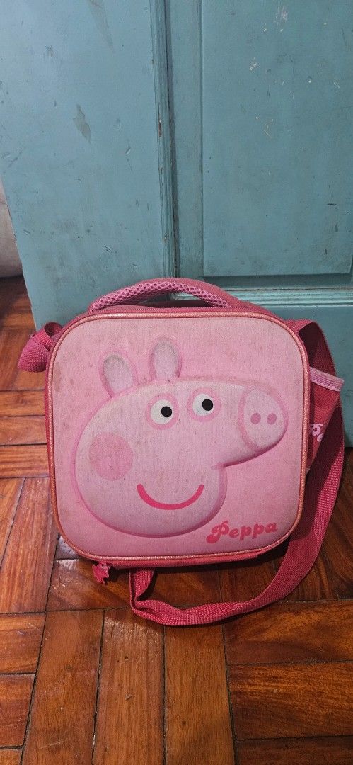 Peppa Pig Lunch Bag (Category: Babies & Kids Fashion) located in Pasig City. Submitted by prettypr1ncess (Listing ID 1434802310, Image 1). Description: - Adorable Peppa Pig lunch bag! - Features a cute pink design. - Convenient handle and shoulder strap. - Spacious interior for lunch and snacks. - Perfect for school and outings!.