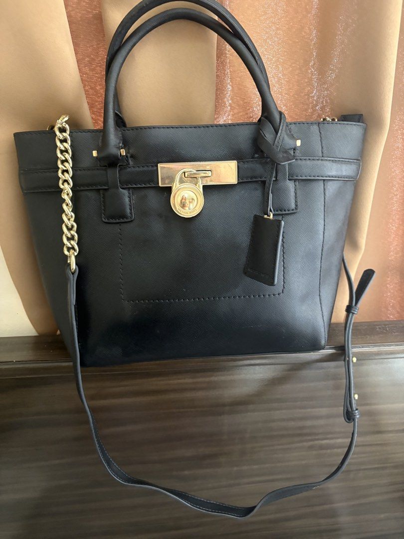 Preloved MK Hamilton Medium Size (Category: Cross-body Bags) located in Lipa City. Submitted by stellar_things (Listing ID 1434655265, Image 1). Description: With hairlines on hardwares No so stunning black.