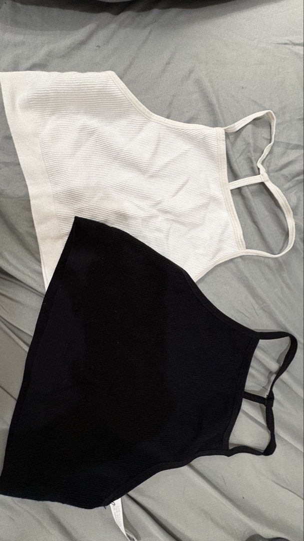 Ribbed Tank Top - Black and White (Category: Sleeveless) located in Dasmarinas. Submitted by the351. (Listing ID 1434700242, Image 1). Description: - Set includes two tank tops: black and white - Size: Small - Design: Halter neck with thin straps - Features: - Textured ribbed pattern.