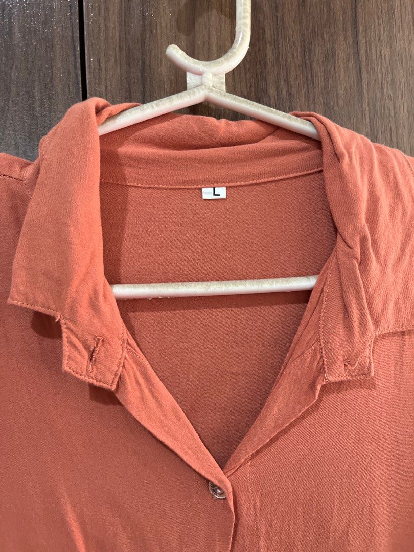 Rust Orange Button Down (Large) (Category: Blouses) located in Angeles City. Submitted by mdxnix (Listing ID 1434615821, Image 3). Description: - Size: Large as per label (can fit Medium to Large body frames) - Free of any purchase - needs ironing - Condition: 6/10 - RFS: no longer wearing 📍Angeles City, Pampanga Please manage your expectations. This is a used clothing item. - The color of the item may vary slightly due to photographic lighting 