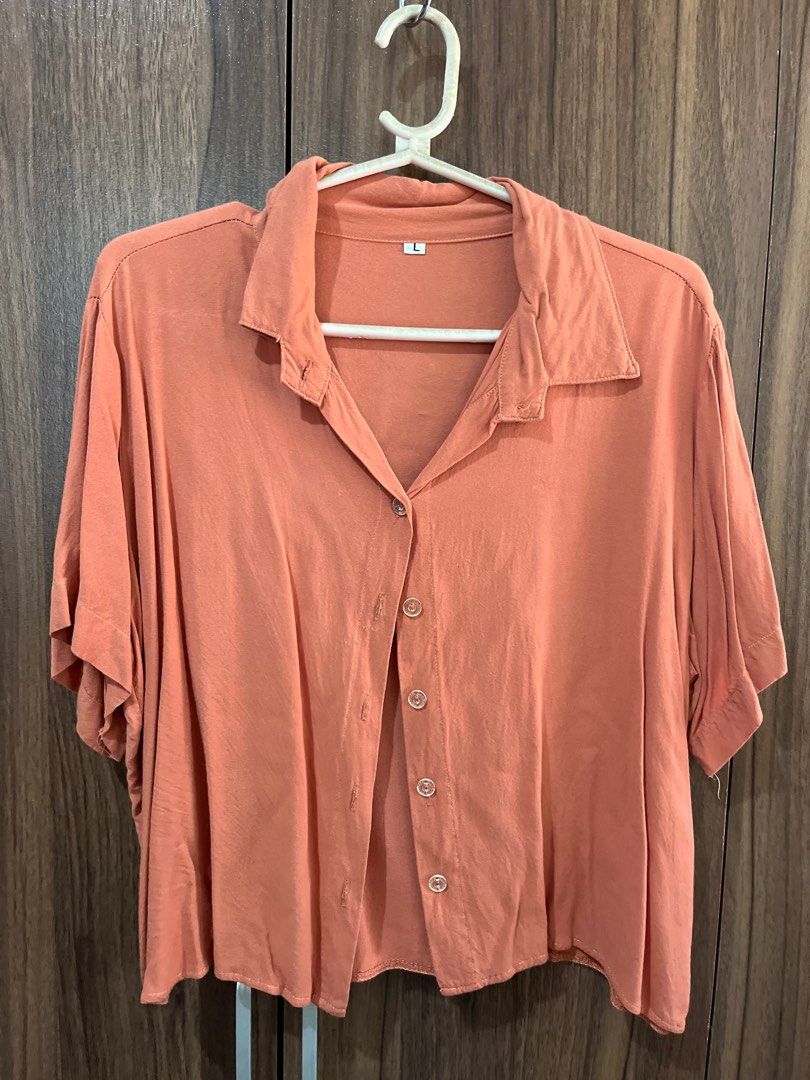 Rust Orange Button Down (Large) (Category: Blouses) located in Angeles City. Submitted by mdxnix (Listing ID 1434615821, Image 1). Description: - Size: Large as per label (can fit Medium to Large body frames) - Free of any purchase - needs ironing - Condition: 6/10 - RFS: no longer wearing 📍Angeles City, Pampanga Please manage your expectations. This is a used clothing item. - The color of the item may vary slightly due to photographic lighting 