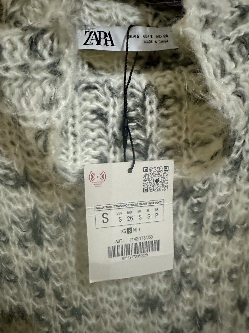Sale! Zara top (Category: Sleeveless) located in Santa Rosa. Submitted by ohbrands (Listing ID 1434737427, Image 3). Description: - Zara sleeveless top - Textured knit design - High neck - Color: White and dark grey - Brand new with tags attached - Dress up or down.