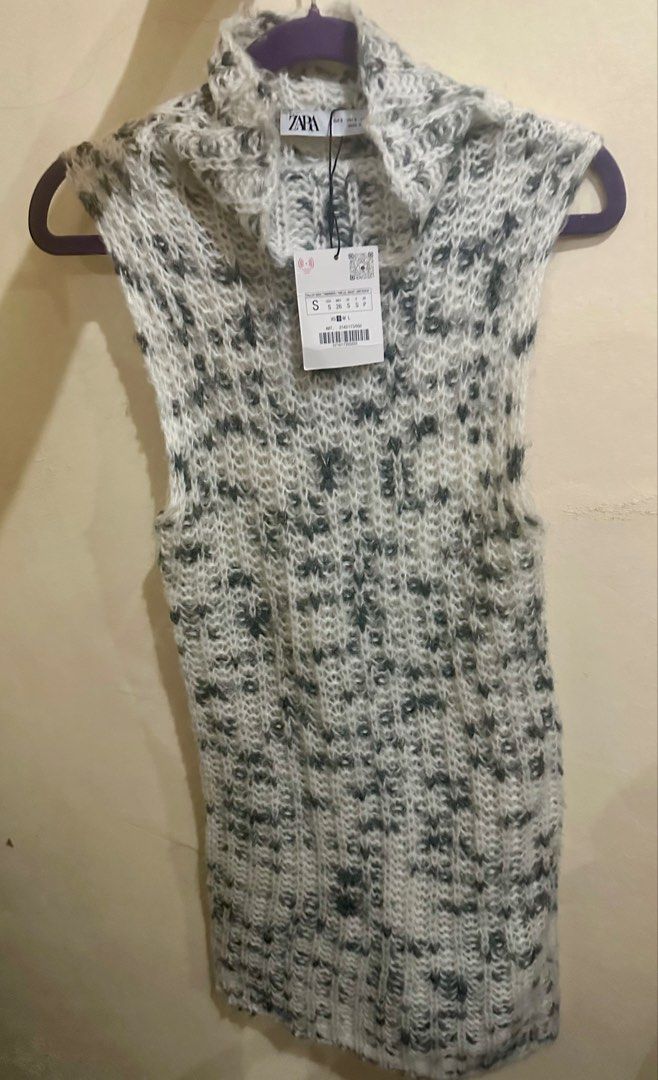 Sale! Zara top (Category: Sleeveless) located in Santa Rosa. Submitted by ohbrands (Listing ID 1434737427, Image 2). Description: - Zara sleeveless top - Textured knit design - High neck - Color: White and dark grey - Brand new with tags attached - Dress up or down.