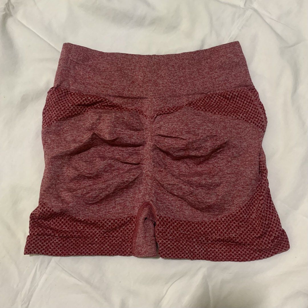 Seamless Workout Shorts (Category: Activewear) located in Naga. Submitted by dayaruee (Listing ID 1434618790, Image 2). Description: - Seamless workout shorts - High-waisted design - Ruched back for a flattering fit - Breathable, textured fabric - Deep maroon color with subtle pattern - Perfect for workouts.
