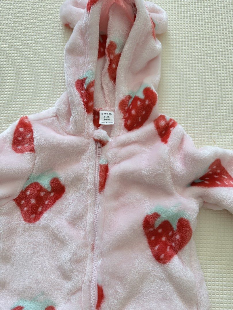 Shein Strawberry Onesie 3-6M (Category: Babies & Kids Fashion) located in Manila. Submitted by bclzt (Listing ID 1434769846, Image 2). Description: - Shein strawberry onesie - Size: 3-6 months - Soft pink fleece material - Cute red strawberry print - Hood with bear ears - Full-length zipper for easy wear worn once #hoodie #onesie #strawberry.
