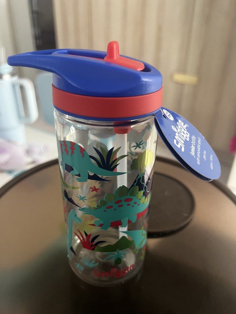 Smiggle Junior Dinosaur Water Bottle (Category: Water Bottles & Tumblers) located in Singapore. Submitted by marvelious (Listing ID 1434689760, Image 1). Description: - Brand new Smiggle water bottle. - Dinosaur design. - Flip-top lid with straw. - Perfect for kids. - Keeps kids hydrated at school or on the go..