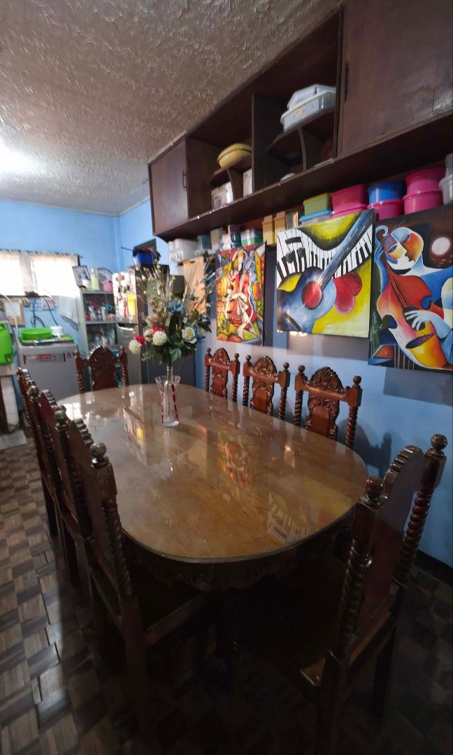 Solid wood Narra Dining Table with Chairs 8 seater (Category: Tables & Sets) located in Quezon City. Submitted by supermario11 (Listing ID 1434777661, Image 2). Description: - Dark wood dining set - Oval table with glass top and decorative edge - 8 Seater - Chairs feature detailed carvings - Classic design, Old Growth Narra - Ideal for Antique Collector "Antique Ilocano". - Deep Reddish Brown and Heavy weight. Loc: Tubao, La Union RFS: Medical Bi