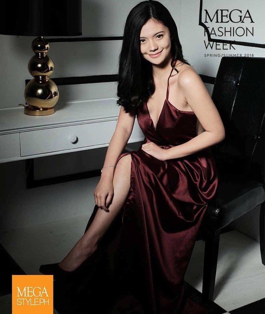 Stylestaple gown burgundy (Category: Dresses) located in Taguig. Submitted by col12345 (Listing ID 1434773279, Image 1). Description: - Burgundy satin maxi dress - Features a flattering V-neckline - Delicate spaghetti straps - High slit on one side - Low back design - Floor-length - Ideal for formal events and special occasions.