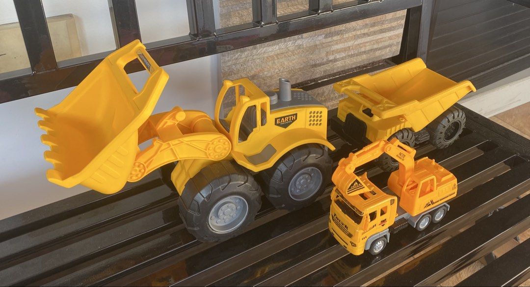 Toy Construction Vehicles Set (Category: Kids Toys) located in Quezon City. Submitted by randy__c (Listing ID 1434785804, Image 1). Description: For Sale : Construction Vehicle Largest one is almost never used. Set as seen in photo Price : 350 RFS : decluttering For delivery : SF will be paid by buyer Whats included : 3 Vehicles.