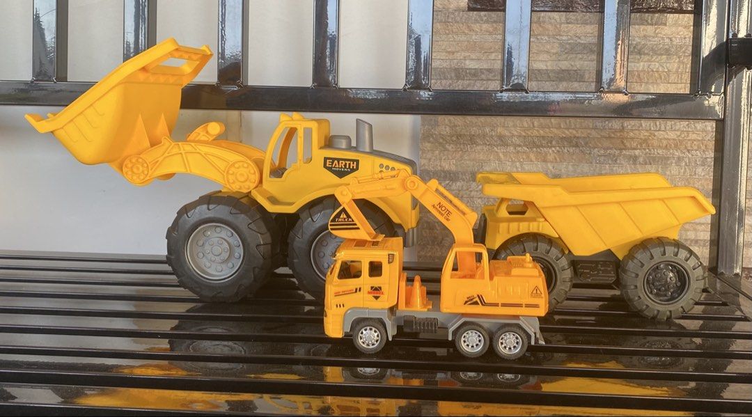 Toy Construction Vehicles Set (Category: Kids Toys) located in Quezon City. Submitted by randy__c (Listing ID 1434785804, Image 2). Description: For Sale : Construction Vehicle Largest one is almost never used. Set as seen in photo Price : 350 RFS : decluttering For delivery : SF will be paid by buyer Whats included : 3 Vehicles.
