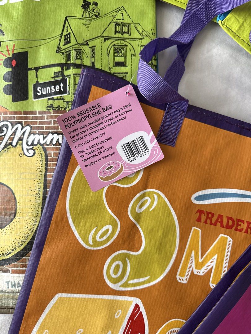 Trader Joe's Reusable Shopping Bags (Category: Tote Bags) located in Manila. Submitted by jeromestanley (Listing ID 1434651313, Image 3). Description: Authentic Trader Joe’s product from USA; each sold separately (not sold as set) - Trader Joe's reusable shopping bags - Features various designs including "Mac & Cheese", "Jam & Peanut Butter", "Avocado", and "California" - Made of 100% reusable polypropylene - Perfect for grocery shopping or carry