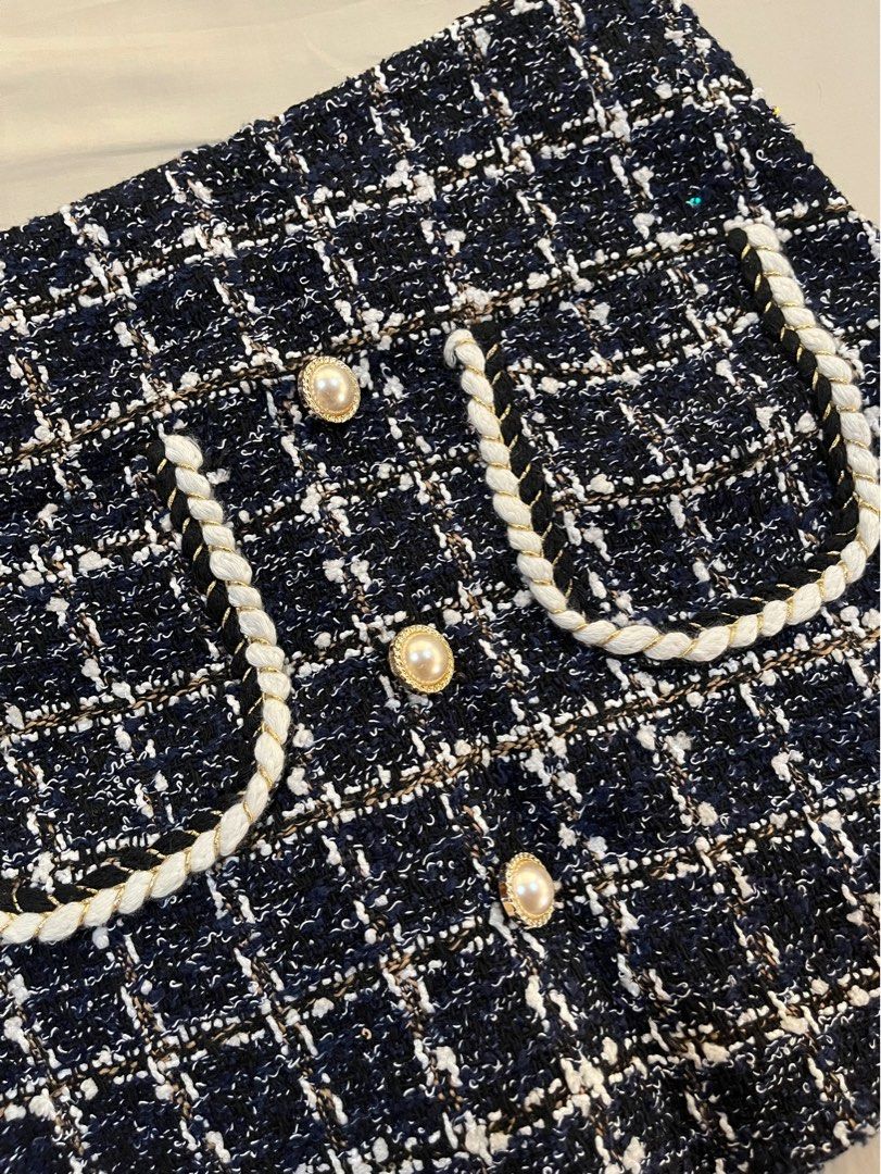 Tweed Mini Skirt with Pearl Buttons (Category: Skirts) located in Quezon City. Submitted by wem.b (Listing ID 1434673113, Image 3). Description: - Classic navy, white, and gold tweed mini skirt - Decorative pockets with white rope trim - Adorned with pearl buttons - Back zipper closure - Perfect for various occasions.