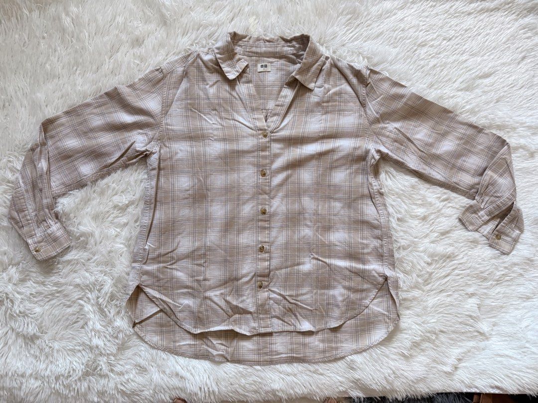 Uniqlo Plaid Shirt [PRELOVED] (Category: Others Tops) located in Manila. Submitted by yelbee (Listing ID 1434772247, Image 2). Description: - Uniqlo plaid shirt - Color: Beige and white - Size: S - Design: V-neck, long sleeves - Material: Rayon - Closure: Button - Style: Casual.