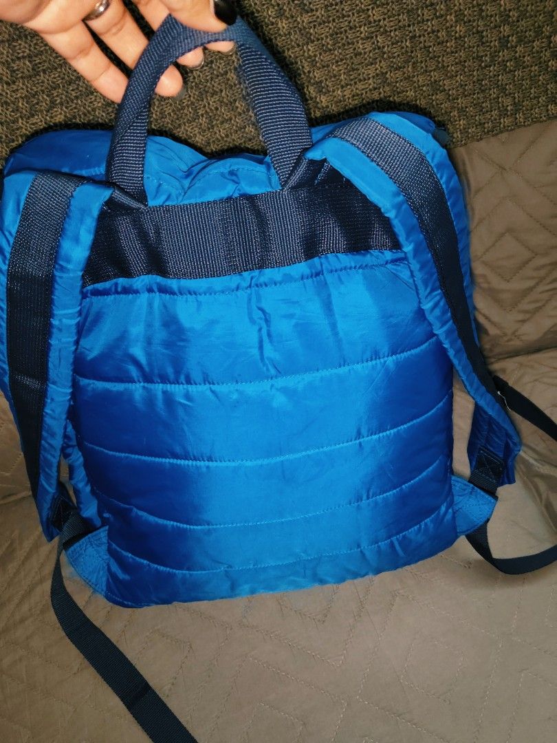 UNIQLO Quilted Backpack (Blue) - Outdoor Nylon Backpack (Category: Backpacks) located in Batangas. Submitted by kasualcornerph (Listing ID 1434691652, Image 3). Description: blue backpack with a quilted design and adjustable straps. - Color: Blue - Design: Quilting - Number of pockets: 2 front pockets - Strap: Adjustable shoulder strap - Fastening: Buckle fastening - Three interior pockets - There is a small hole (about the size of a pinhole) on 