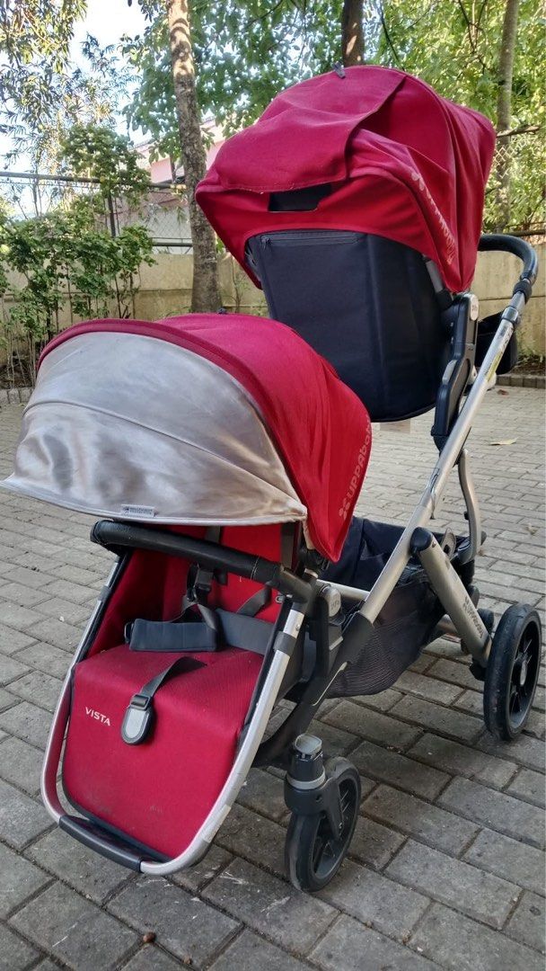 UppaBaby Vista Stroller with Rumble Seat (Category: Strollers) located in Paranaque City. Submitted by beagarciachoy (Listing ID 1434637343, Image 3). Description: - UppaBaby Vista stroller with rumble seat and ride-along board - Red canopy and seats - Silver frame - Black handle and wheels - Includes storage basket - UppaBaby logo visible.