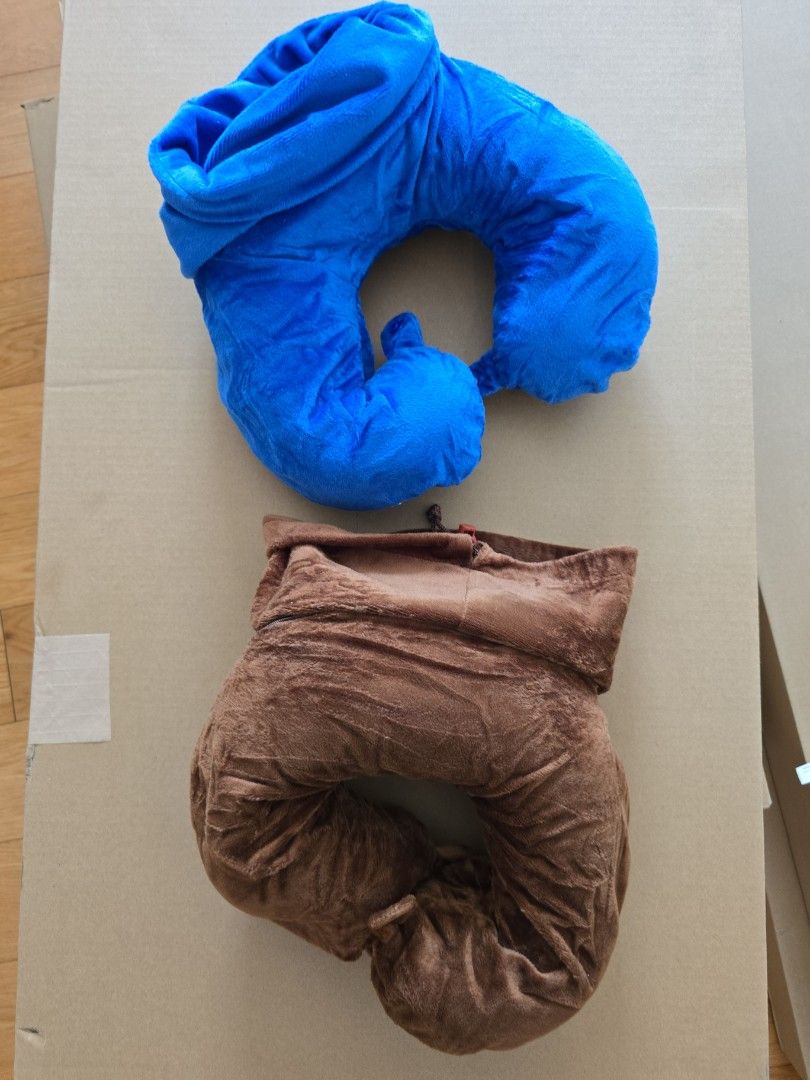 U-Shaped Travel Pillow (Category: Travel Essentials & Accessories) located in Makati City. Submitted by marge.g (Listing ID 1434682606, Image 2). Description: - Two U-shaped travel pillows included. - Colors: Blue and Brown. - Made of soft, plush material. - Designed for neck support during travel. - With attached bag to occupy smaller space. - 2 pcs for P300.