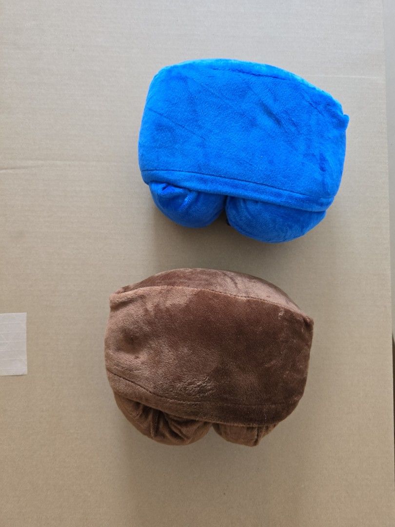 U-Shaped Travel Pillow (Category: Travel Essentials & Accessories) located in Makati City. Submitted by marge.g (Listing ID 1434682606, Image 3). Description: - Two U-shaped travel pillows included. - Colors: Blue and Brown. - Made of soft, plush material. - Designed for neck support during travel. - With attached bag to occupy smaller space. - 2 pcs for P300.