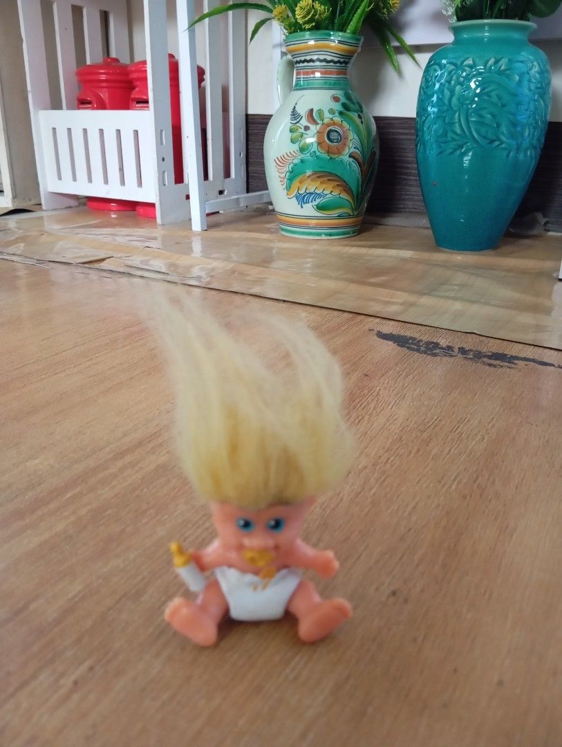 Vintage Baby Troll Doll (Category: Plushies & Soft Toys) located in Muntinlupa City. Submitted by thriftsmuntinlupa26 (Listing ID 1434614150, Image 1). Description: - Adorable vintage baby troll doll - Features bright yellow hair and blue eyes - Dressed in a diaper - Comes with a bottle and pacifier - Marked "Made in China" - Perfect for troll doll collectors!.