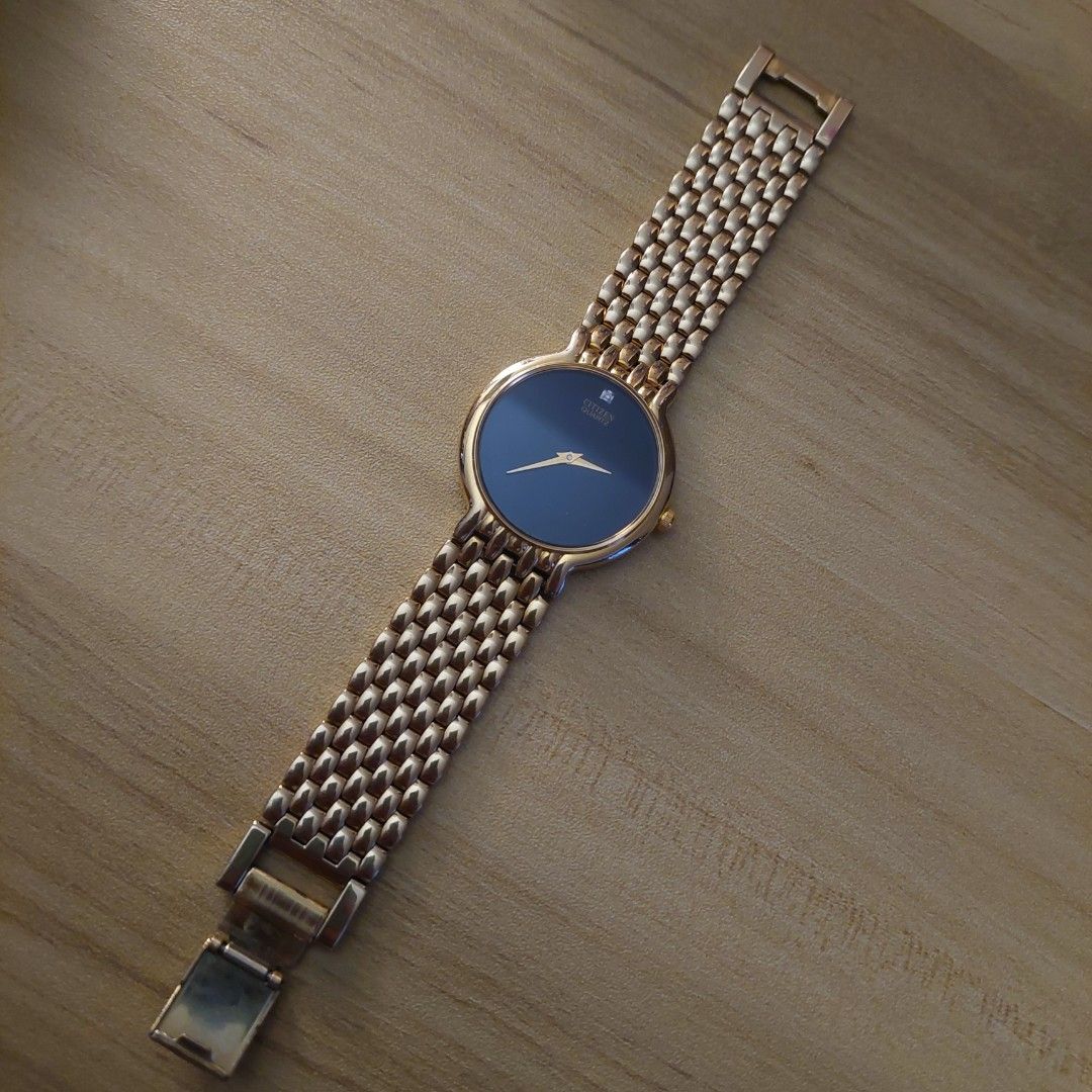 Vintage Citizen Quartz Watch (Category: Women's Watches) located in Marikina City. Submitted by mackbear (Listing ID 1434682560, Image 1). Description: - Round face with clasp closure -15 cm wrist, with additional links can probably adjust to 15.24 cm (6 in) -pre loved, good condition, no visible scratches, with some scratches in back case A refined vintage Citizen quartz dress watch, estimated from the 1990s era, showcasing timeless Japanese cra