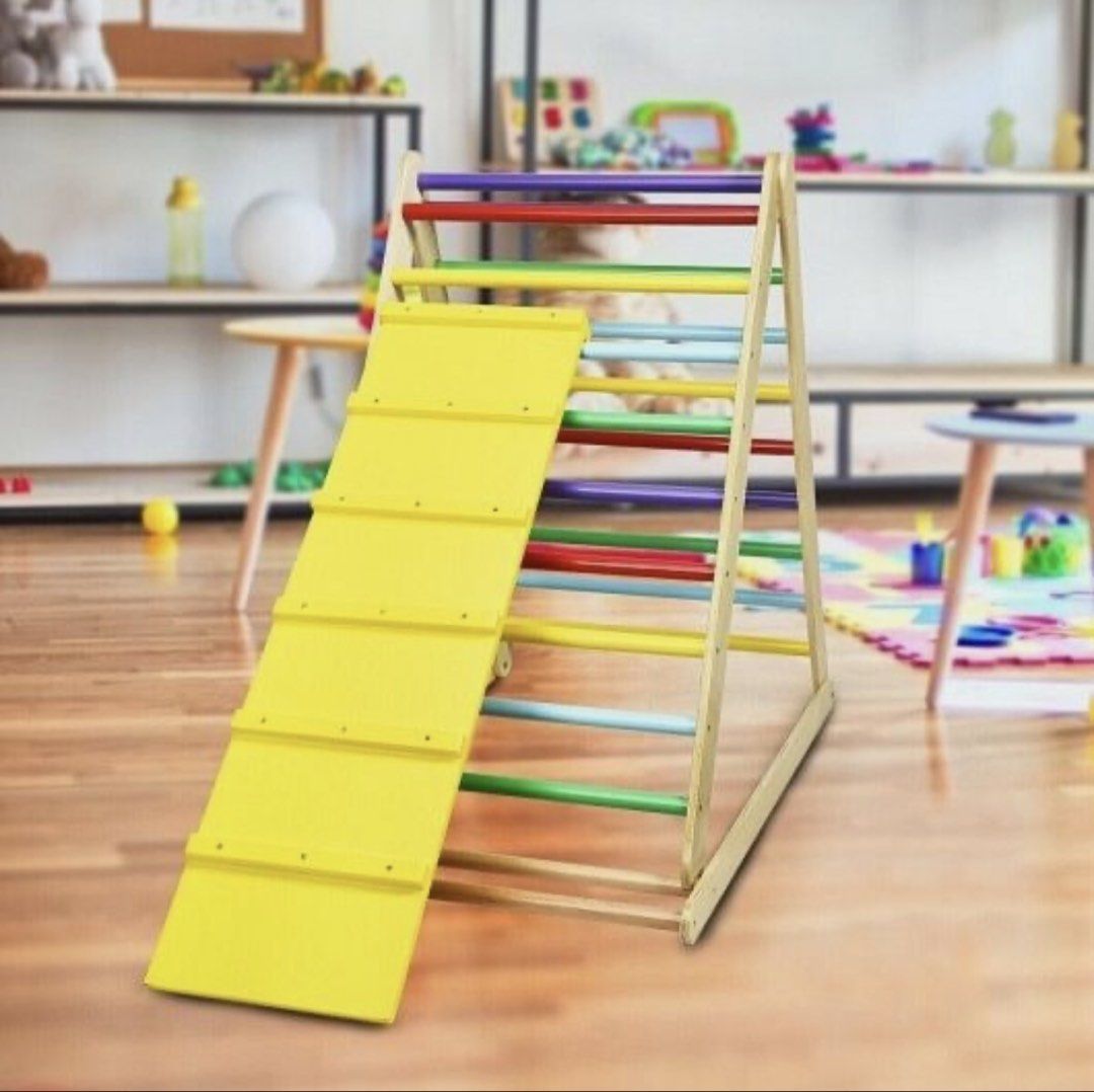 Wooden Climbing Triangle with Slide (Large Pickler) (Category: Infant Playtime) located in Paranaque City. Submitted by beagarciachoy (Listing ID 1434636415, Image 1). Description: - Wooden climbing triangle with colorful rungs. - Includes a yellow slide. - Encourages climbing and sliding for physical activity. - Improves coordination. - Sturdy and well-built frame. - Suitable for indoor and outdoor use. - Slide is easily attached and detached. -