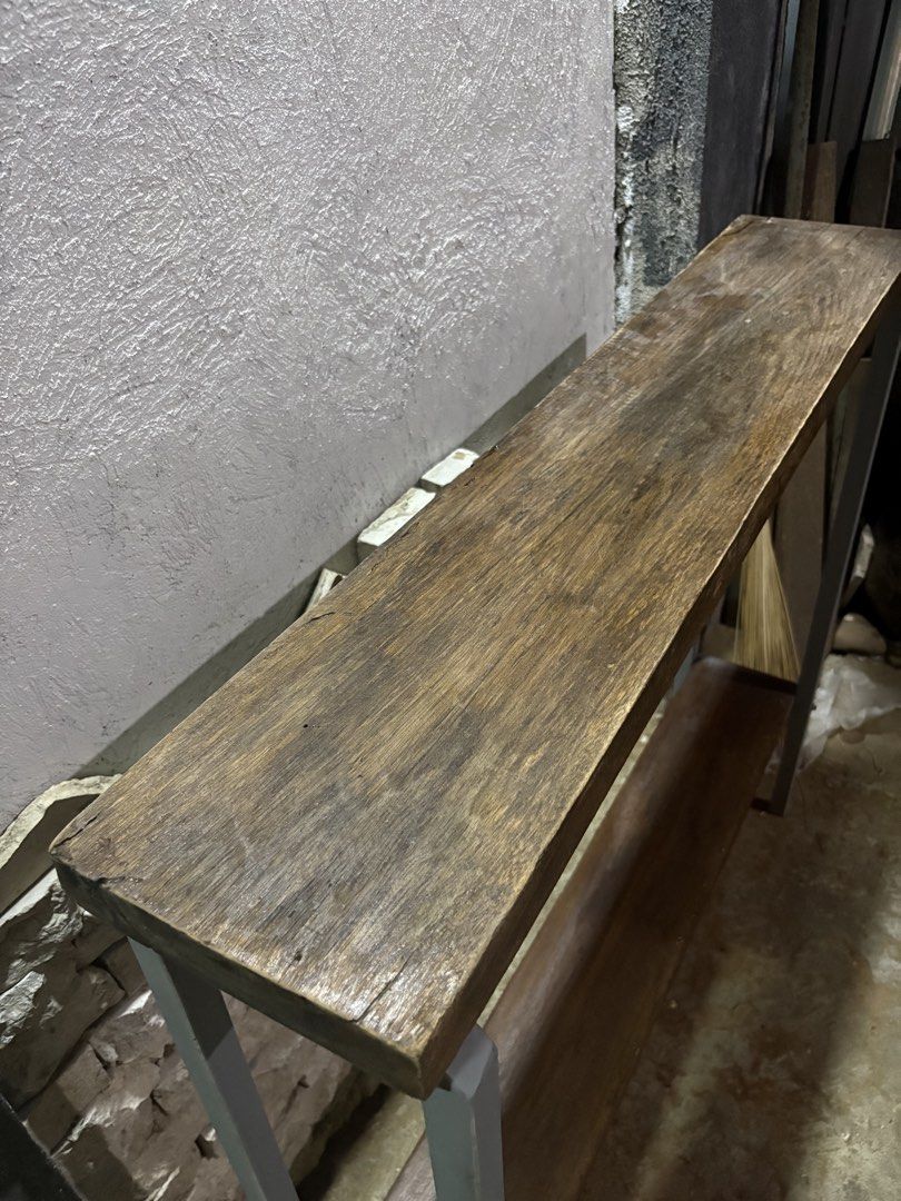 Wooden Console Table with Metal Frame (Category: Tables & Sets) located in Pasig City. Submitted by casambhomedecors (Listing ID 1434738042, Image 2). Description: - Wooden top with natural grain - Sturdy metal frame - Includes a lower shelf for storage - Warm wood tone - Ideal for entryway or living room - Great for displaying decor or storing items.