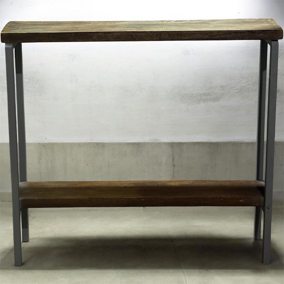 Wooden Console Table with Metal Frame (Category: Tables & Sets) located in Pasig City. Submitted by casambhomedecors (Listing ID 1434744177, Image 1). Description: - Wooden top with natural grain and warm tone - Sturdy metal frame in a neutral color - Includes a lower shelf for storage - Ideal for entryways or living spaces - Offers both display and storage functionality.