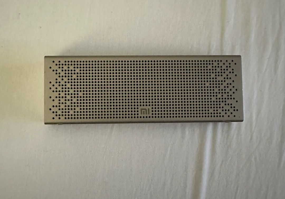 Xiaomi Mi Bluetooth Speaker (Category: Soundbars, Speakers & Amplifiers) located in San Juan City. Submitted by looneybin559 (Listing ID 1434627312, Image 2). Description: - Xiaomi Mi Bluetooth Speaker - Sleek, portable design - Silver color - Perforated metal build with Xiaomi logo - AUX input and micro-USB port - Volume and playback control buttons - No box Used once. Just kept in storage. WYSIWYG. ***ITEM IS AVAILABLE IF YOU CAN SEE THIS MESSA