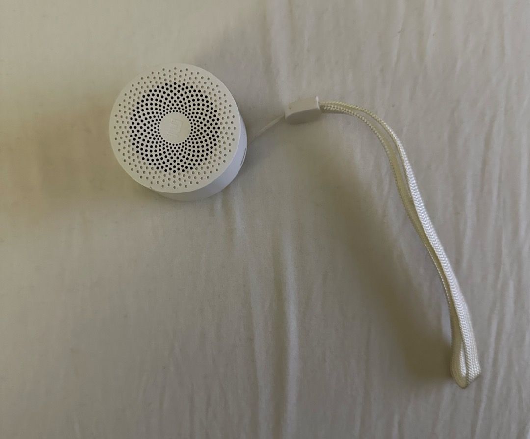 Xiaomi Mi Compact Bluetooth Speaker 2 (Category: Soundbars, Speakers & Amplifiers) located in San Juan City. Submitted by looneybin559 (Listing ID 1434627046, Image 2). Description: - Xiaomi Mi Compact Bluetooth Speaker 2 (White) - Compact and portable design - Circular shape with speaker grill - Power button located on the back - Includes a white lanyard for easy carrying - Ideal for listening to music anywhere - No box Used once. Just kept in s