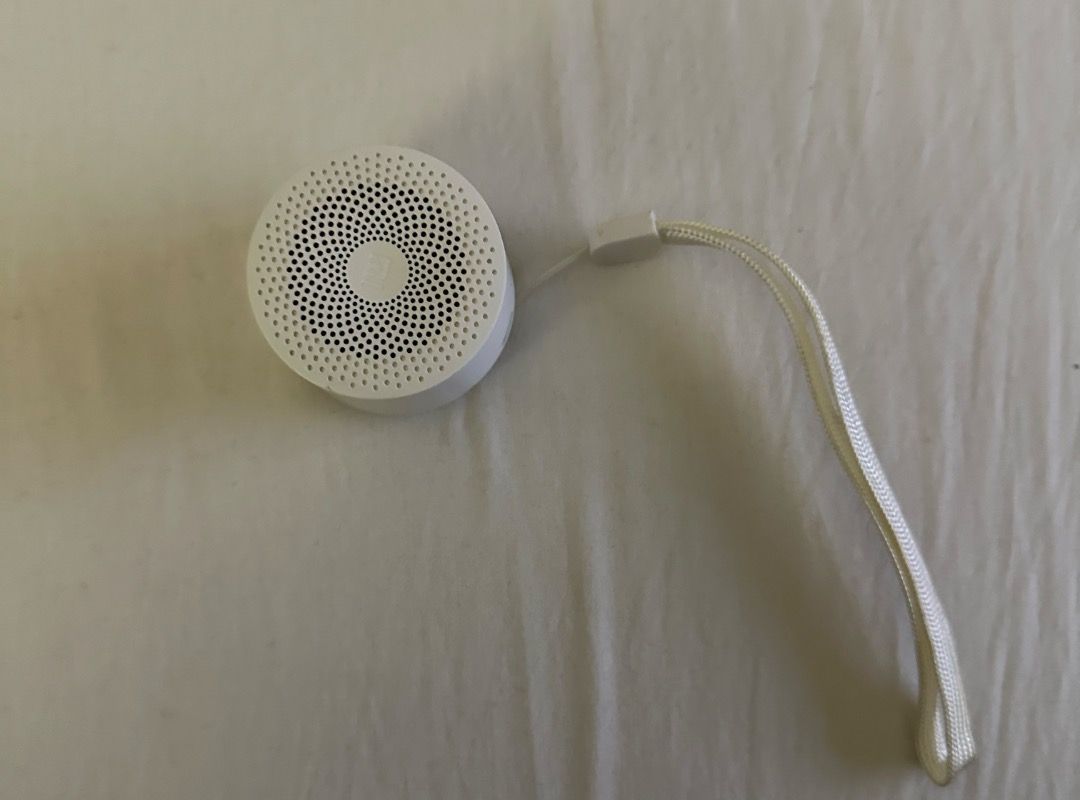 Xiaomi Mi Compact Bluetooth Speaker 2 (Category: Soundbars, Speakers & Amplifiers) located in San Juan City. Submitted by looneybin559 (Listing ID 1434627046, Image 1). Description: - Xiaomi Mi Compact Bluetooth Speaker 2 (White) - Compact and portable design - Circular shape with speaker grill - Power button located on the back - Includes a white lanyard for easy carrying - Ideal for listening to music anywhere - No box Used once. Just kept in s
