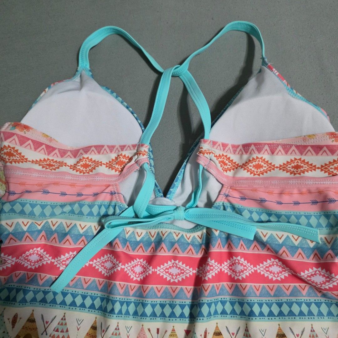 2XL Boho Print One-Piece Swimsuit (Category: Bikinis & Swimsuits) located in Manila. Submitted by plussizedpixie (Listing ID 1434750242, Image 3). Description: - One-piece swimsuit - Boho print with pink, blue, and orange accents - Halter neck design - Criss-cross straps at the back - Ruched bust detail - Colorful geometric and tribal pattern.