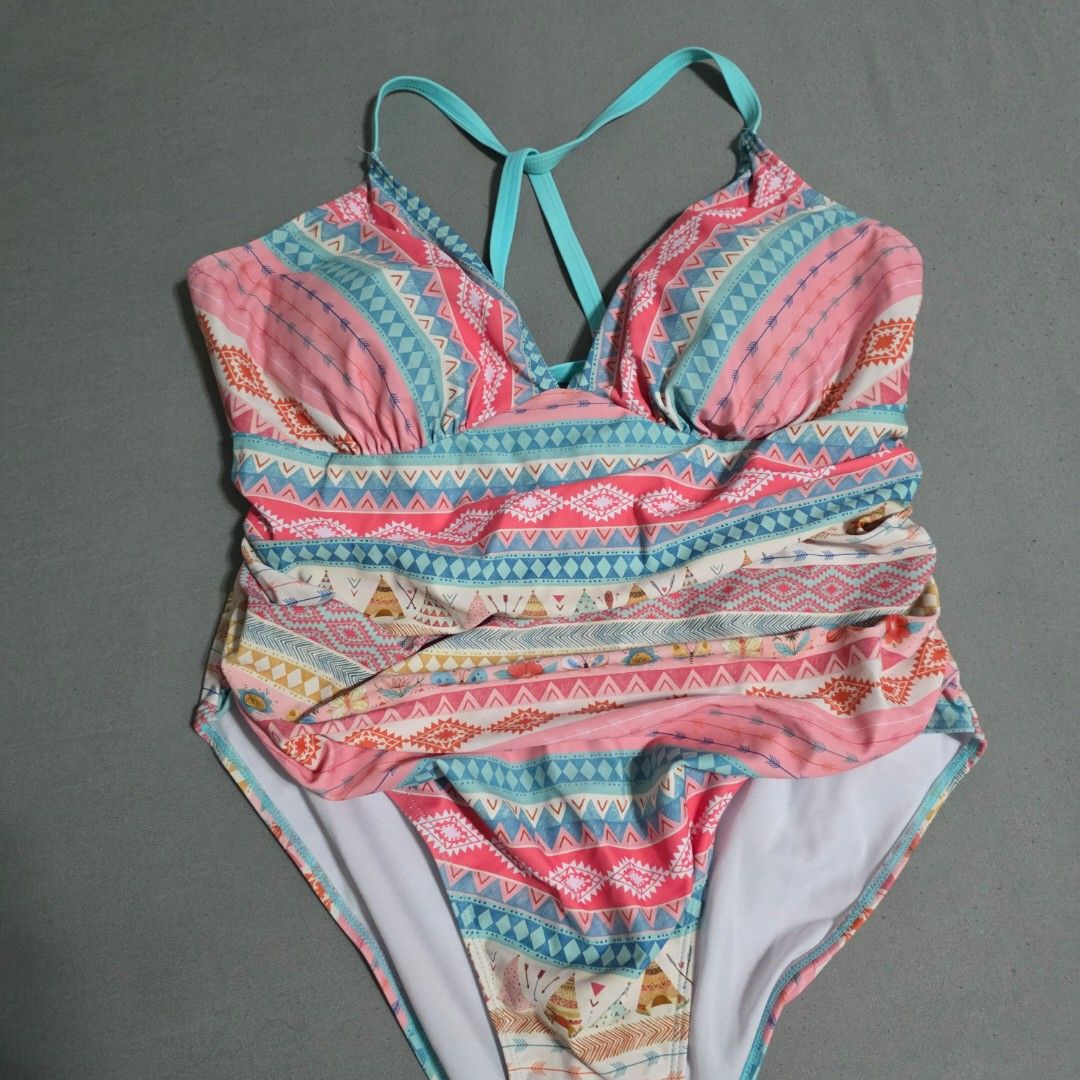 2XL Boho Print One-Piece Swimsuit (Category: Bikinis & Swimsuits) located in Manila. Submitted by plussizedpixie (Listing ID 1434750242, Image 1). Description: - One-piece swimsuit - Boho print with pink, blue, and orange accents - Halter neck design - Criss-cross straps at the back - Ruched bust detail - Colorful geometric and tribal pattern.