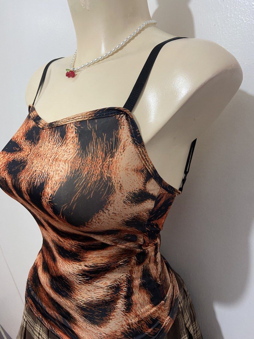 Y2k Cheetah Print Camisole Top (Category: Sleeveless) located in Mandaluyong City. Submitted by cxia_style (Listing ID 1434781516, Image 3). Description: Top Only‼️ ♡ washed & ready-to-wear ♡ all items are handpicked ♡ nationwide shipping ♡ see each photo for more details. DM us for more info 💌.