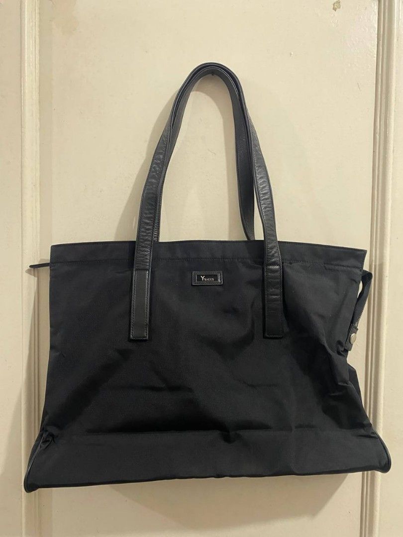 Y's Sacs Black Tote Bag (Category: Tote Bags) located in Manila. Submitted by aurafits (Listing ID 1434655790, Image 1). Description: Excellent condition - Y's Sacs black tote bag - Zippered main compartment - Multiple interior pockets - Leather handles - Small logo detail - Durable, water-resistant material - Black interior lining - Secure zipper closure.