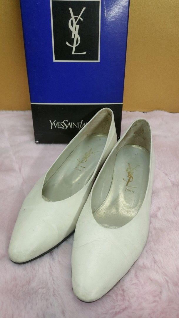 Yves Saint Laurent White Leather Pumps (Category: Sneakers & Footwear) located in Manila. Submitted by Alljapan (Listing ID 1434712056, Image 1). Description: - Yves Saint Laurent pumps - White leather - Size 36 1/2 - Pointed toe design - Features YSL logo - Black soles - Includes original box.
