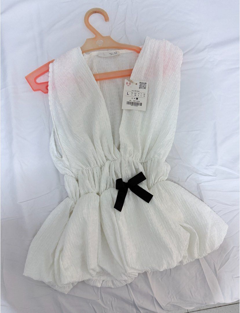 Zara White Sleeveless Top with Bows (Category: Sleeveless) located in Mandaue City. Submitted by knucklehead2 (Listing ID 1434783241, Image 2). Description: BNWT Flaw: missing one ribbon so i’m selling it low.