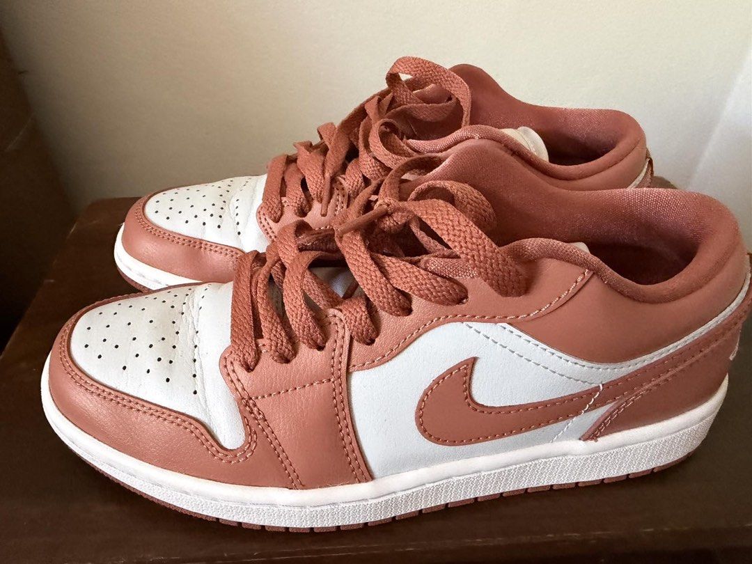 Air Jordan 1 Low - Terracotta (Category: Sneakers) located in Makati City. Submitted by blushvanilla (Listing ID 1434821690, Image 2). Description: - Air Jordan 1 Low sneakers - Color: Terracotta and white - Iconic Nike swoosh - Air Jordan wings logo on the heel - White midsole - Terracotta outsole - Terracotta-colored laces - Perforated toe box for breathability.