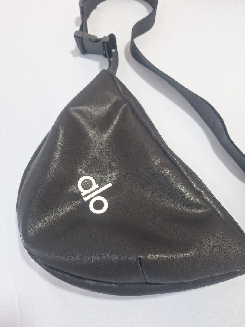 Alo Yoga Black Fanny Pack (Category: Sling Bags) located in Singapore. Submitted by favoured5 (Listing ID 1434824970, Image 1). Description: - Alo simple fanny pack in black - Soft, comfortable material - Zippered main compartment - Adjustable strap with buckle - Features the Alo logo - Ideal for carrying essentials - No wear and tear - Selling, as too many bags #Sport #Cycle #Exercise #Daily #Sling Bag .