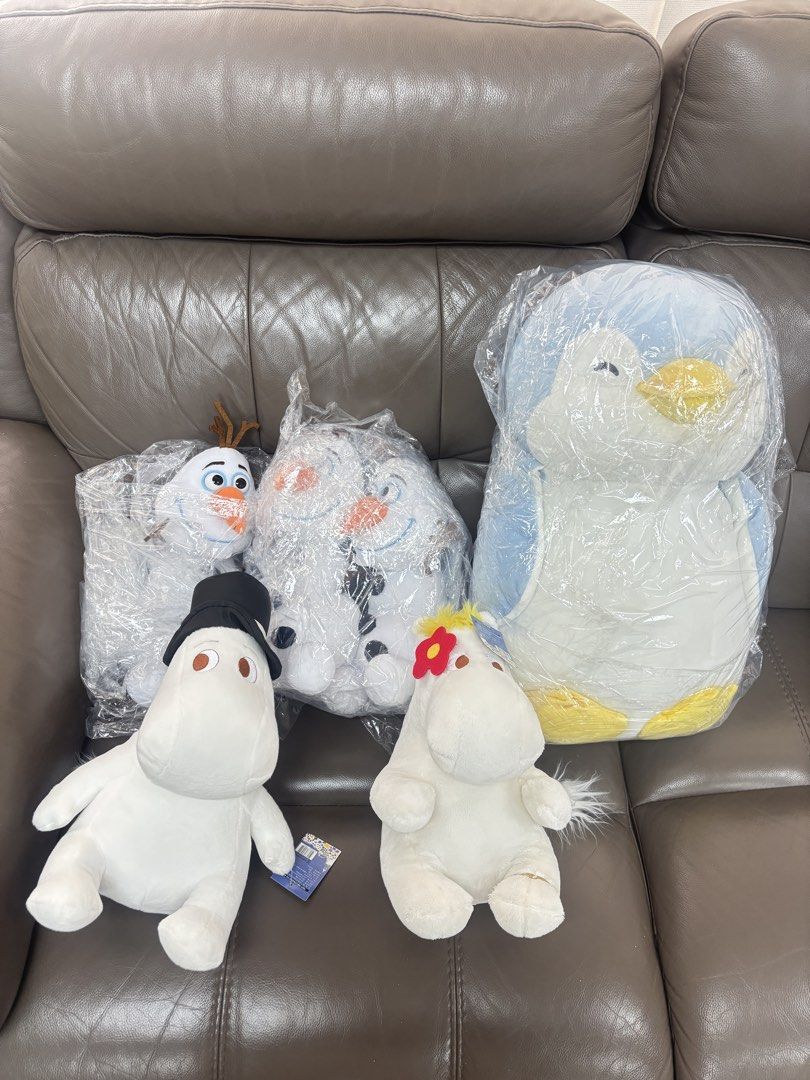 Assorted Plush Toys - Olaf, Penguin, Moomin (Category: Toys & Games) located in Singapore. Submitted by munyennyo (Listing ID 1434853118, Image 1). Description: - Collection of cute plush toys. - Includes Olaf (Frozen), a large penguin, and Moomin characters. - Some toys still in original packaging. - Perfect for collectors or gifts..