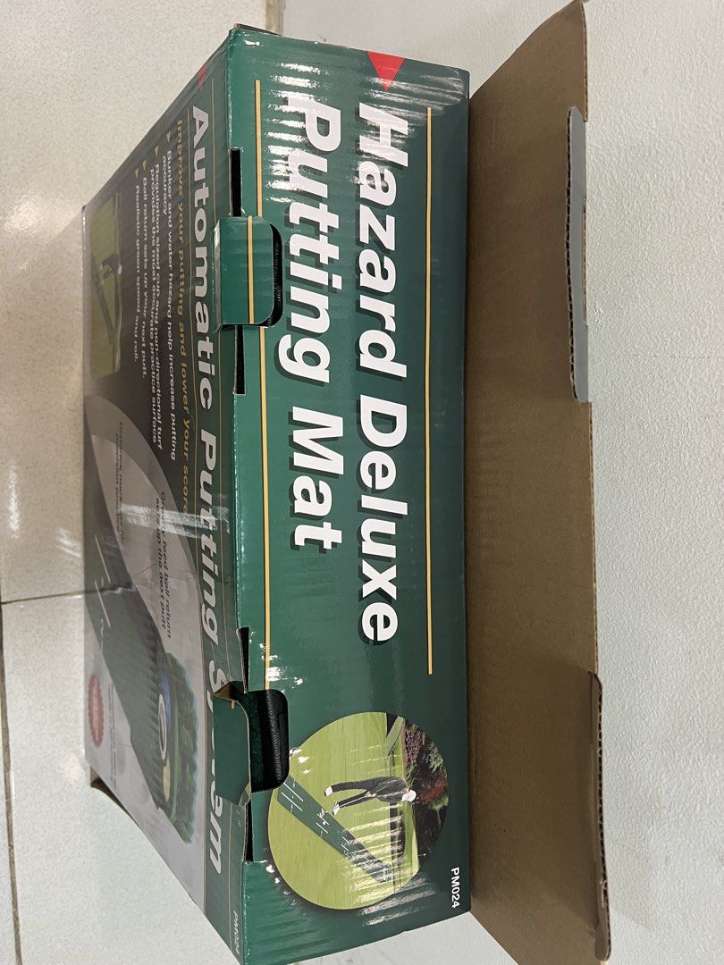 Automatic Putting System Hazard Deluxe Putting Mat (Category: Golf) located in Manila. Submitted by pau_only (Listing ID 1434935782, Image 3). Description: Improve your putting accuracy with this Automatic Putting System. It features a regulation-sized cup, non-directional turf, and a realistic green speed. The system includes a bunker and water hazard to help increase putting accuracy. It also has distance markings for precision practice and a g