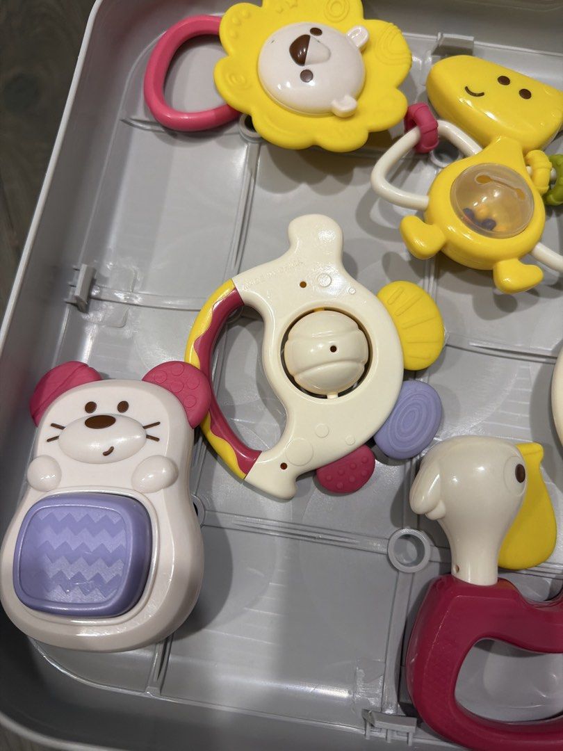 Baby Rattles Set/Teether Set (Category: Infant Playtime) located in Manila. Submitted by 17thfinds (Listing ID 1434934438, Image 2). Description: - Adorable baby rattle set. - Features lion, dinosaur, and mouse designs. - Designed with various textures. - Produces different sounds to stimulate senses. - Made of colorful, baby-friendly plastic. - Keeps babies entertained..