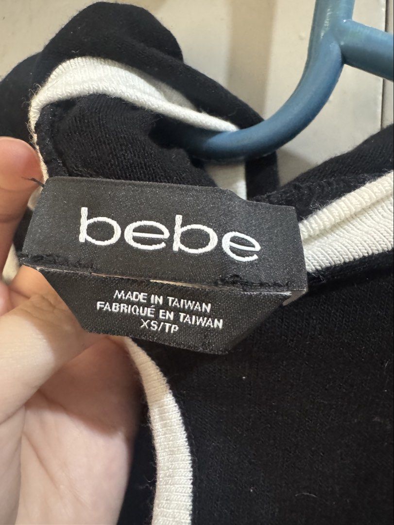 Bebe Sleeveless Top with Hood (Category: Sleeveless) located in Valenzuela. Submitted by declutter203 (Listing ID 1434948298, Image 2). Description: - Bebe black sleeveless top - Size xs MOP: Gcash/Maribank MOD: J&T or Grab/lalamove.