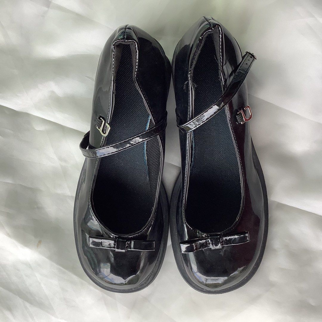 Black Mary Jane Shoes with Bow (Category: Heels) located in Cabanatuan. Submitted by chieezyx (Listing ID 1434894187, Image 2). Description: - Black Mary Jane shoes - Glossy finish - Small bow detail - Adjustable strap - Size 40 .