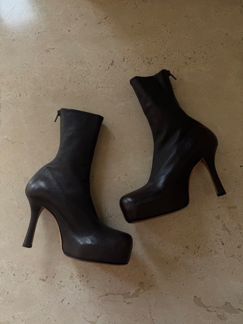 Bottega Veneta Bold Leather Ankle Boots (Category: Sneakers & Footwear) located in Pasig City. Submitted by x.declutter (Listing ID 1434930131, Image 1). Description: - Dark Chocolate Brown Color -HEEL: 9 CM - Back Zip Closure - VOLUMINOUS ROUNDED TOE - SOLE WITH PLATFORM - 100% LEATHER - MADE IN ITALY *last Photo for reference only AVAILABLE FOR SHIPPING FROM AUG 23-28 ONLY.