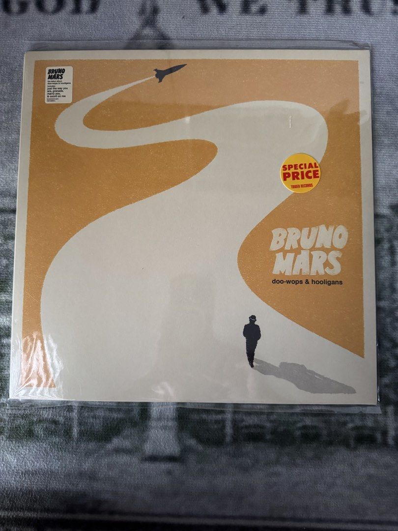 Bruno Mars - Doo-Wops & Hooligans 12” LP (Category: Vinyls) located in Quezon City. Submitted by fruits26 (Listing ID 1434993042, Image 1). Description: - Original, sealed vinyl record - Bruno Mars' "Doo-Wops & Hooligans" album - Features album art - Includes a 'Special Price' sticker - Still in original packaging.