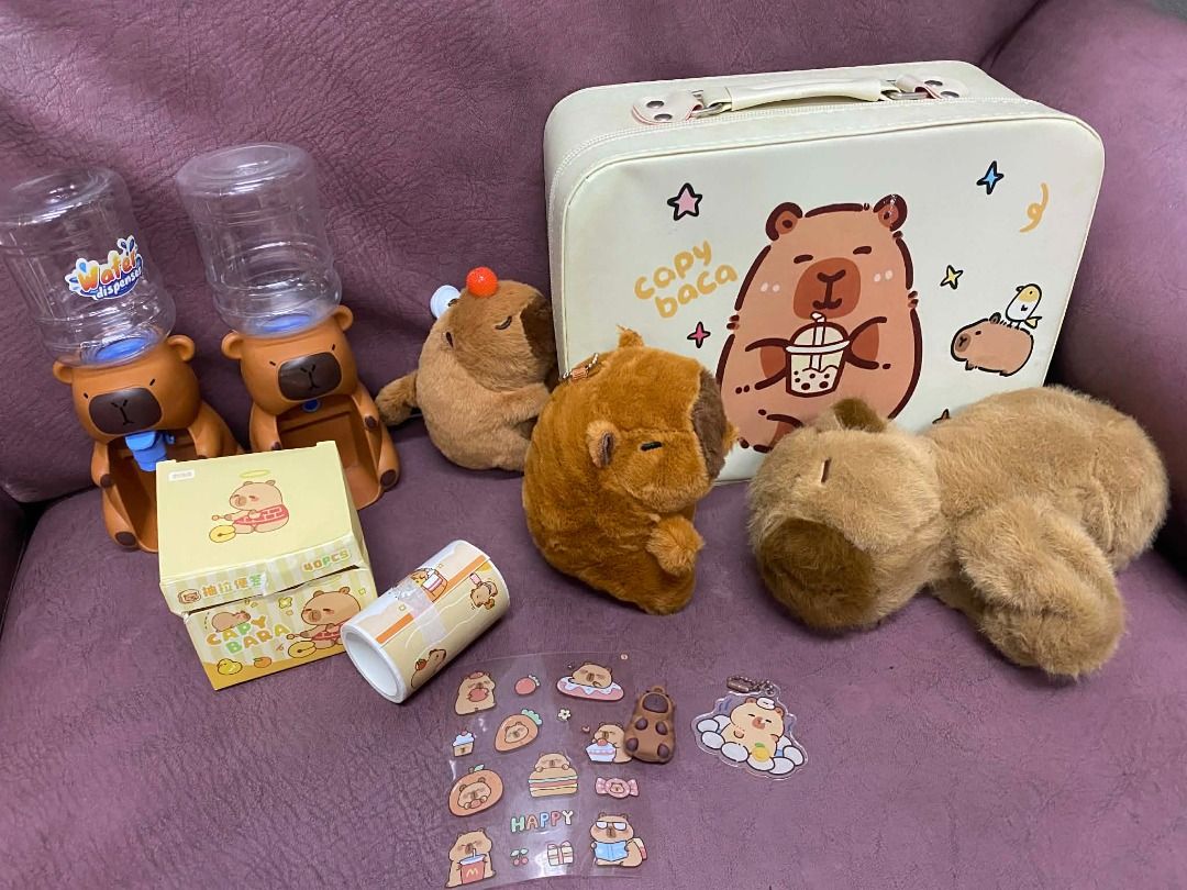 Capybara assorted plushies and sticker and bag (Category: Plushies & Soft Toys) located in Makati City. Submitted by pdcmakati (Listing ID 1434855086, Image 1). Description: SELLING AS SET ONLY!! pickup location: makati city brand: capybara price: 450 slightly negotiable 1. plushie1 keychain capybara bag charm (brandnew) 2. plushie2 pull tail capybara 3. plushie3 clipon capybarya (preloved) 4. capybara roll sticker (brandnew) 5. capybara transpar