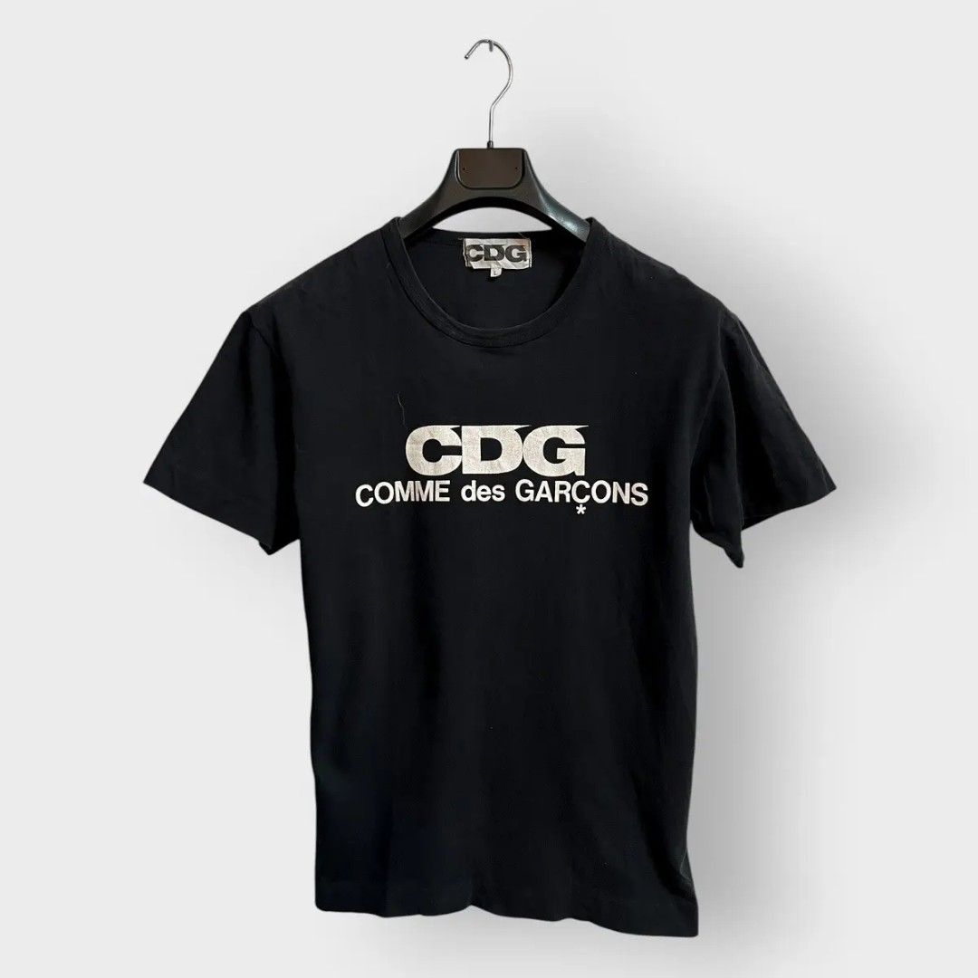 CDG Comme des Garcons Black T-shirt (Category: Tshirts & Polo Shirts ) located in Manila. Submitted by lostfromsanity (Listing ID 1434880986, Image 1). Description: 2010s CDG logo shirt nego for sure buyers dm for more pics and details bought from dover street no major issues .