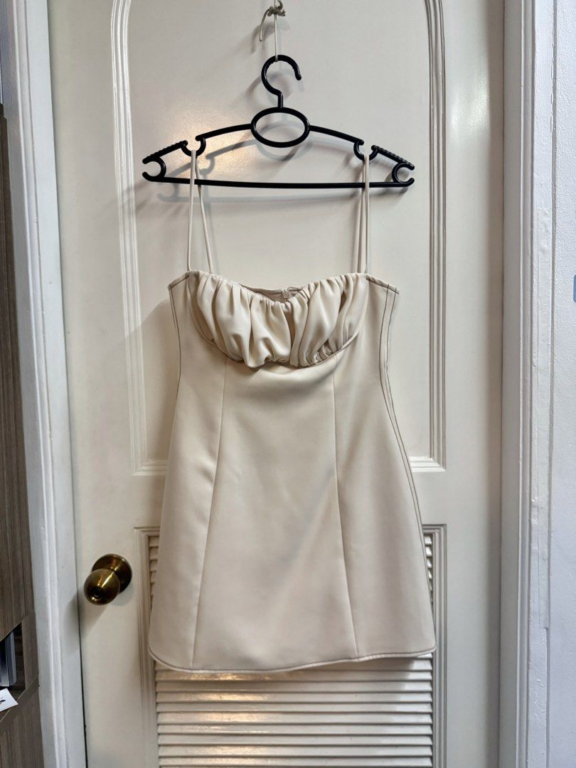 CHANANYA Cream Mini Dress (Category: Dresses) located in Manila. Submitted by mae-v (Listing ID 1434943640, Image 1). Description: - CHANANYA mini dress (Thailand Brand) - Cream color - Sweetheart neckline - Thick, high quality fabric - Gathered fabric detail at bust area - Thin straps - Fitted silhouette until waist, flares out at hip area - Size M (32 bust, 26 waist best fit) - Zipper closure at the back - Visible stitching details - Used once.