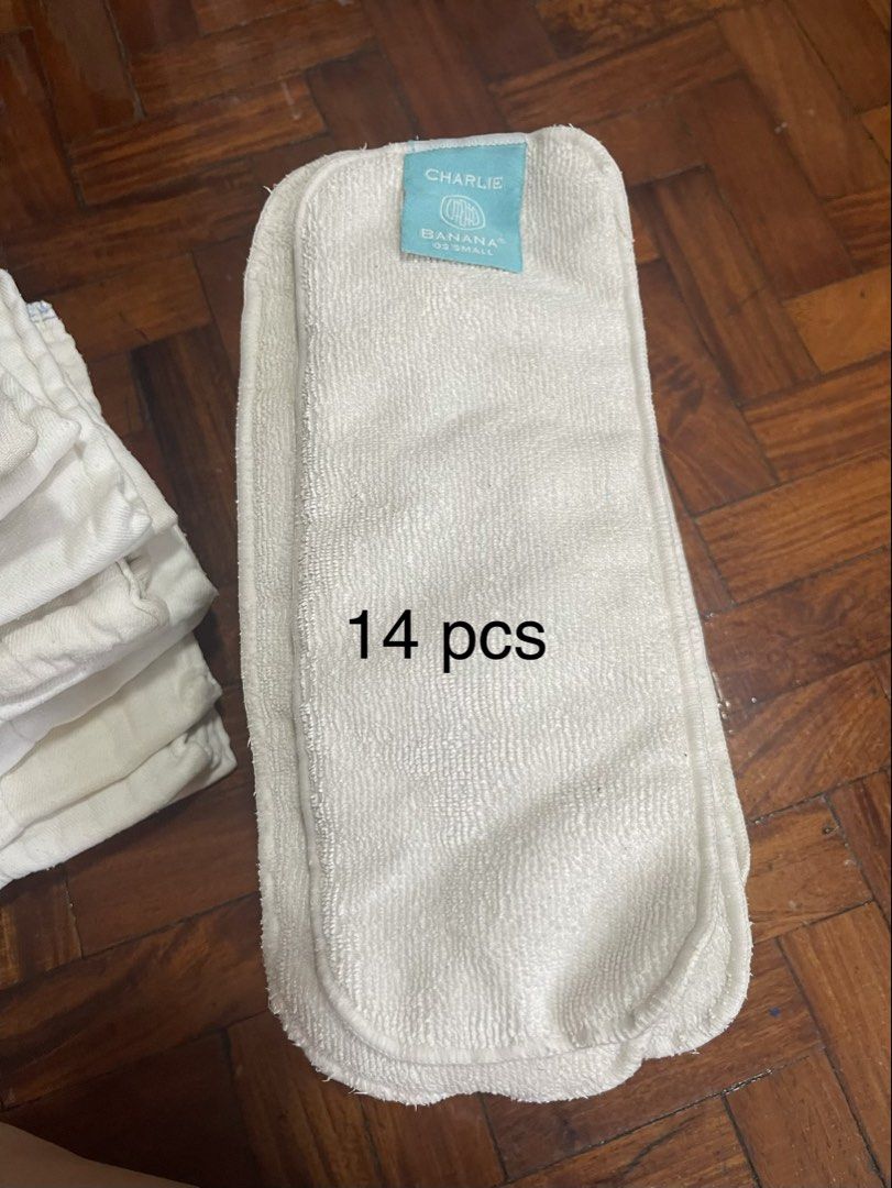 Cloth Diapers Set (Category: Diapers & Baby Wipes) located in San Juan City. Submitted by kriszy_coo (Listing ID 1434859929, Image 3). Description: Bought in the US. - 12 colorful cloth diapers - 15 white cloth inserts - 14 Charlie Banana inserts - Reusable and washable - Eco-friendly alternative to disposable diapers - Various colors and patterns available.