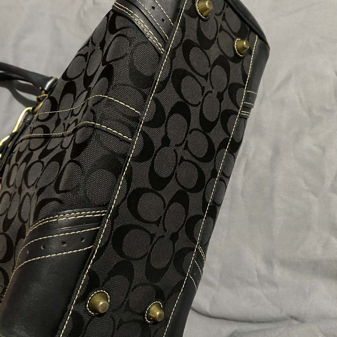 Coach Black Signature Handbag (Category: Luxury Bags & Wallets) located in Bacolod City. Submitted by unkemptrags (Listing ID 1434951545, Image 3). Description: - Authentic Coach handbag - Black with signature C pattern - Rank AB - Issue Minimal sign of use - Features leather accents - Double handles - Decorative tassel - Gold-tone clasp and hardware - Interior Coach tag with serial number L0673-10509 - Structured shape with stitched design 3,499