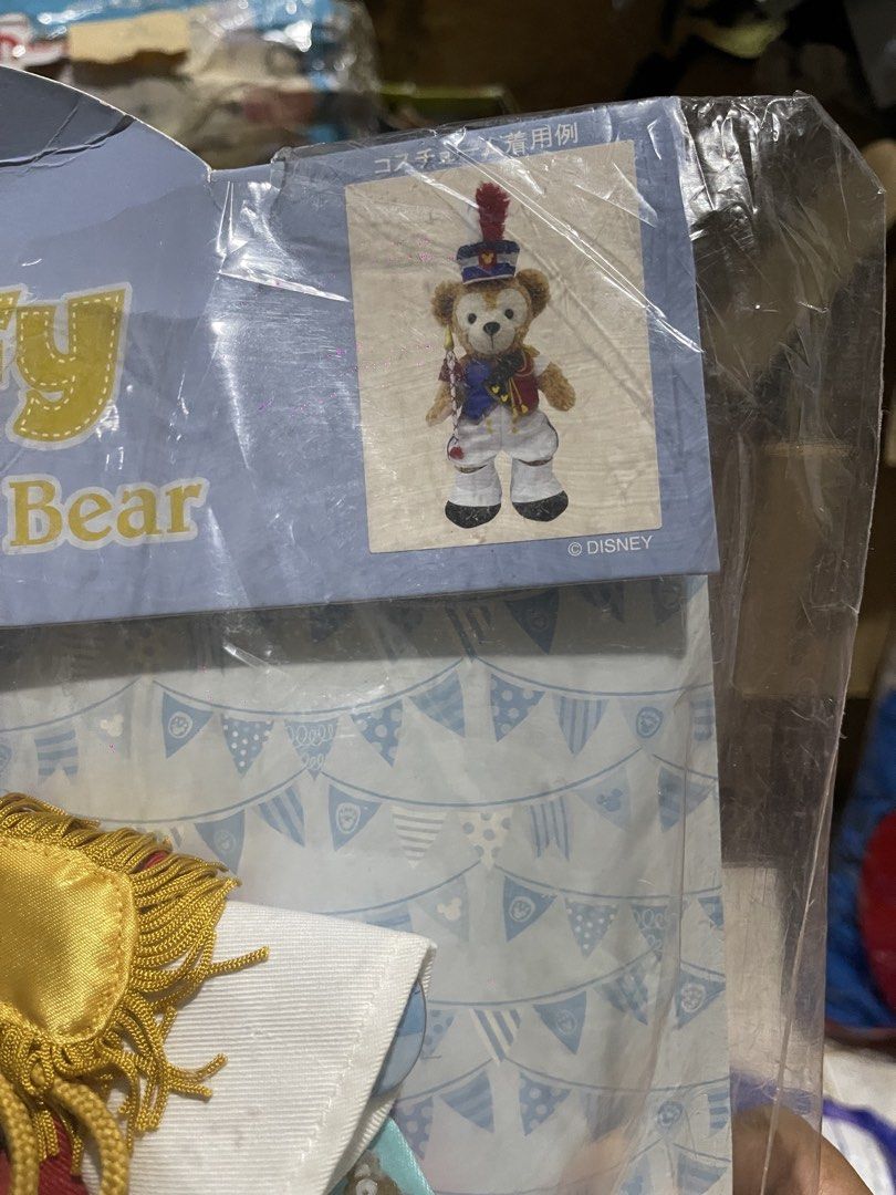 Duffy The Disney Bear Costume Set (Category: Plushies & Soft Toys) located in Muntinlupa City. Submitted by joanofarc1013 (Listing ID 1434817673, Image 2). Description: Duffy the Disney Bear costume set from Tokyo Disney Resort. The set includes a blue hat, a blue jacket, a white shirt, and other accessories. The packaging features the Duffy bear wearing the costume. It is a collectible item for Duffy fans..